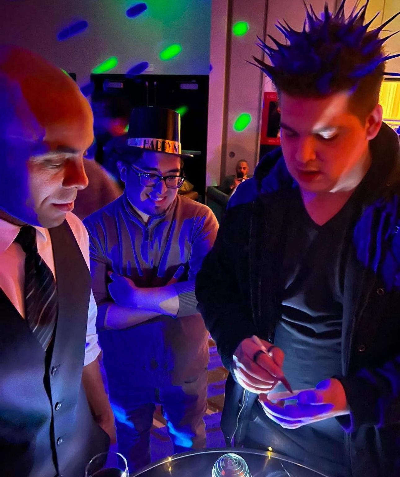 Marko performing a card trick for guests at an event